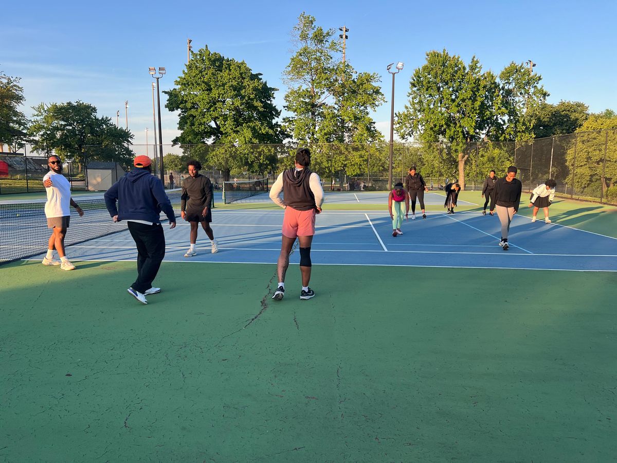 Members playing a match on court